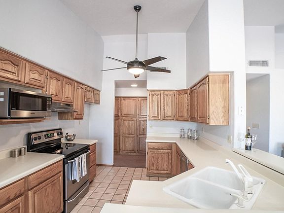 Kitchen with stainless steel appliances.