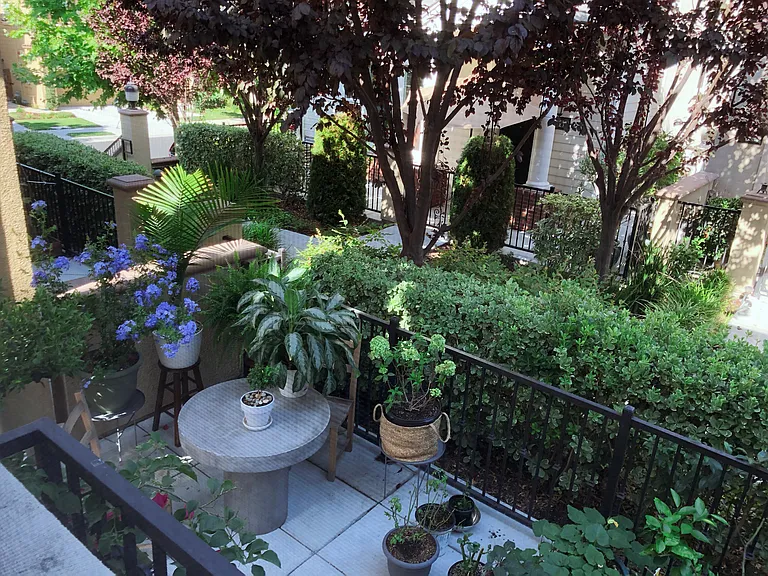 The home features a small private patio for outdoor seating