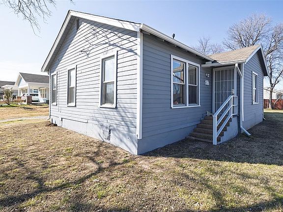 View of home''s exterior featuring a lawn