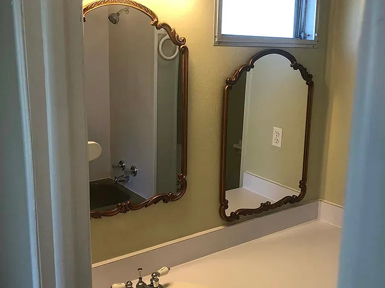 Vanity with mirrors.