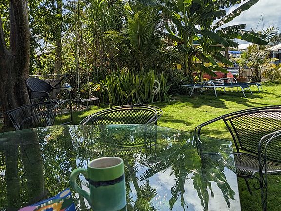 Enjoy morning coffee and peace by the pool. Most days there is a nice breeze.