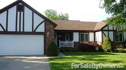 Brick & Stucco Ranch Chalet
						:
						Porch & nice landscaping - Japanese Maple, Alberta Spruce, Mulch & flower beds.