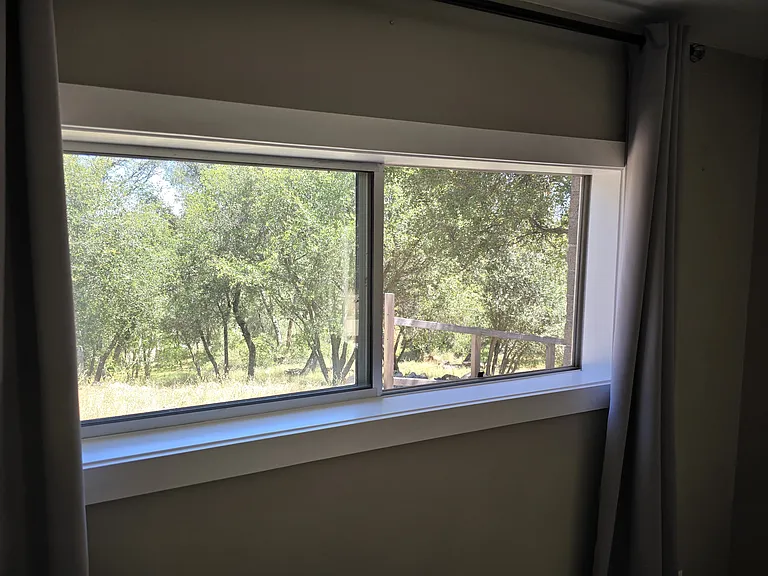 North window and view in the Living area.