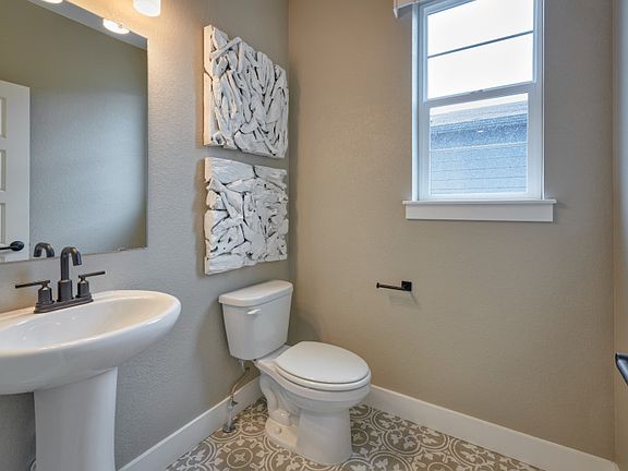 The downstairs features an additional half bath.