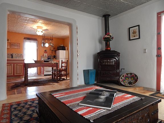 Relax with a cosy fire in the antique porcelain wood stove