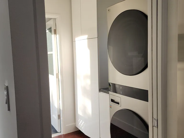 laundry room with storage
