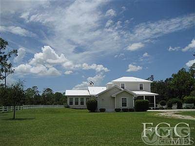 C H A R M I N G ... Front (East side) of Old Florida style 2977/4224 sf., 3 bedroom plus loft, GREATROOM home in an EXQUSITE country setting.  2.64 ACRES... (backs up to Six Mile Cypress Preserve).  It is quiet, private, close to everything off the Daniels corridor. A great place to grow... Bring the your horses, kids and friends. Enjoy the best of TOWN AND COUNTRY LIVING, minutes to everything. Daniels (opposite Fiddlesticks Blvd.), take Palamino to stop sign, turn left at Penzance (to end of Penzance... (Paseo on the left).  Turn left on Caisson Lane, to 12400 Caisson Lane (a private, gravel road).