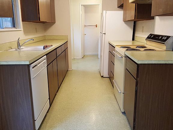 View from downstairs into the kitchen, laundry room and half bath.