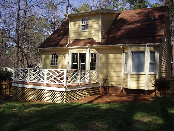 Freshly stained deck, new paint on railing