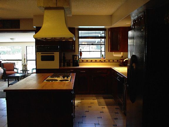Large kitchen with island and eating area.