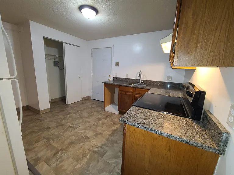 Kitchen as seen from Bedroom door.