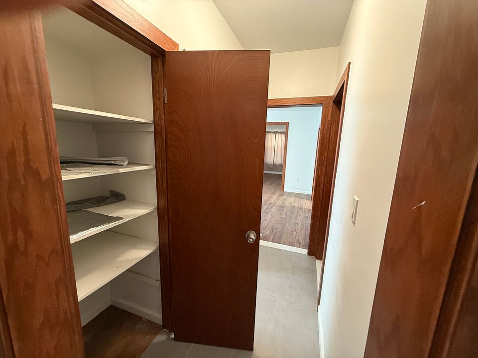 Hallway closet with built-in storage