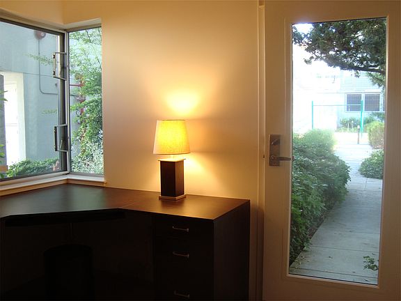 Drenched in light, furnished with handsome built-ins.