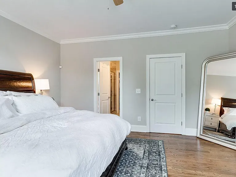Master bedroom leading to full en suite bathroom