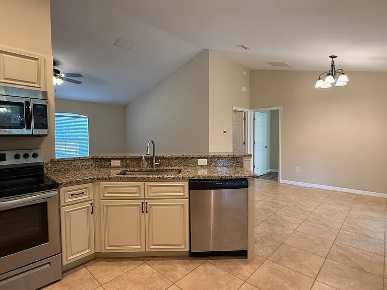 Kitchen to dining area view.
Kitchen and dinning area comes with tile flooring.