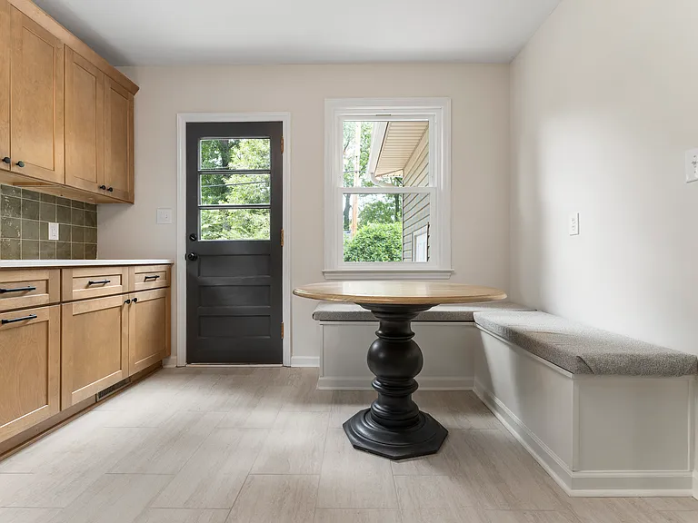 Kitchen has built in banquet seating- offering additional storage inside and a great spot for dining or working.