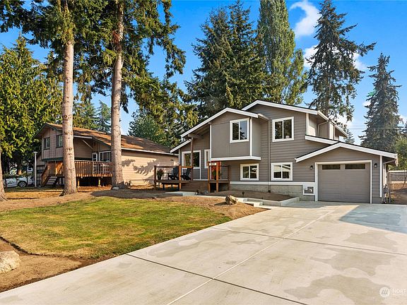 Freshly poured cement driveway and walkway.>