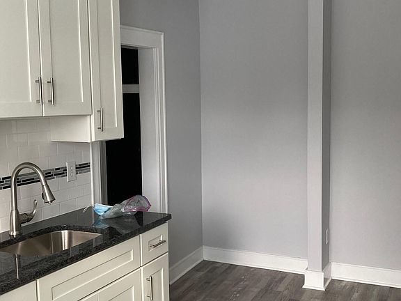 Kitchen Hallway door opening, Luxury Vinyl and warm colors.