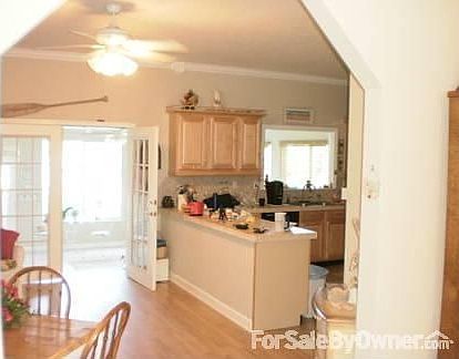 Plenty of glass for views : Living room, kitchen,French doors and down to Florida room over looking 
