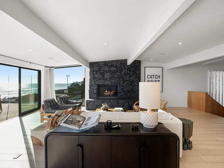 Slide open the glass doors and let the fresh sea air fill the space.