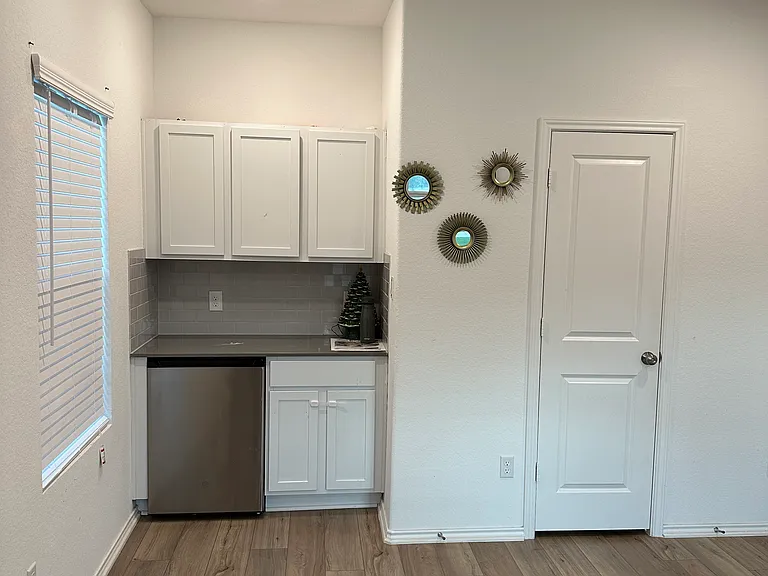 Refrigerator and bathroom in downstairs office. Can also be used as 5th bedroom.