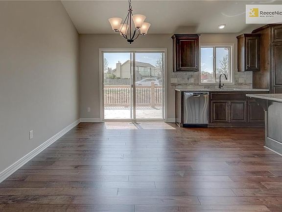Prefinished wood flooring in kitchen, entry and breakfast. Sliding glass door leads out to spacious deck.
