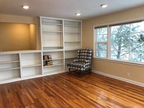 Large Living room with built-in shelves