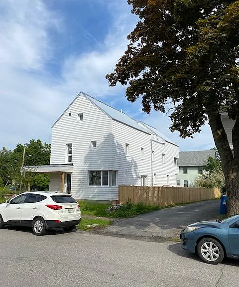 Tenant's entrance and small fenced-in backyard. An interior fence divides the two fenced-in backyards.