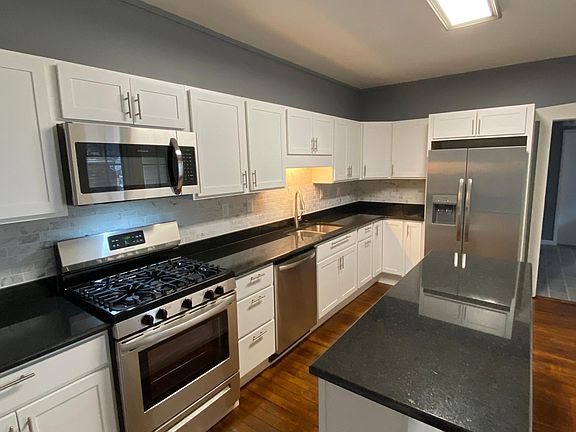 Brand new kitchen with granite countertops.