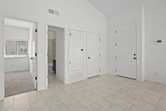 Living room showing entrance to room 1 and guest bathroom
