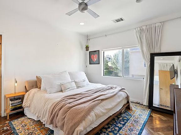 Primary Bedroom upstairs off kitchen and living room with private full bathroom and large closet.