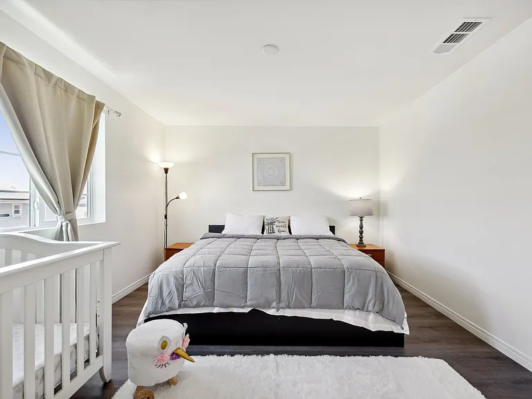 Sleep in luxury! This spacious bedroom features a king-size bed for the ultimate comfort and relaxation.