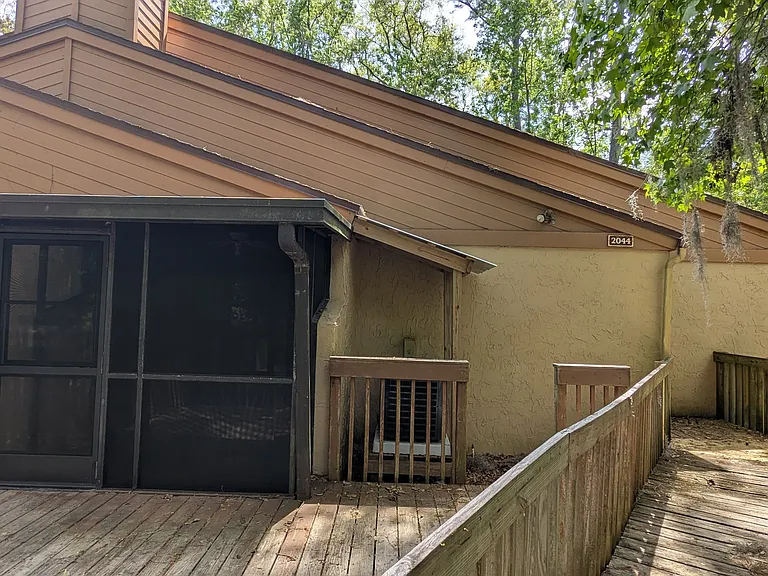 Deck, screened room, walkway to front door
