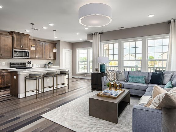 Model Representation - Family Room Open to the Spacious Kitchen with Upgraded Features and Finishes