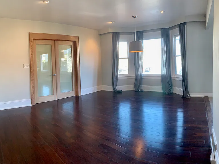 Doors from entryway living room to separate living room