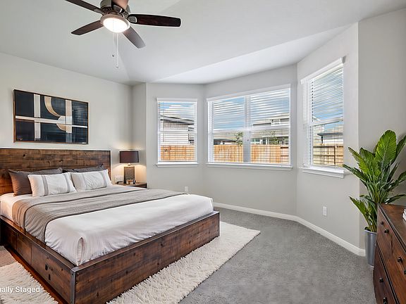 Virtually staged primary suite in the Medina floorplan at a Meritage Homes community.