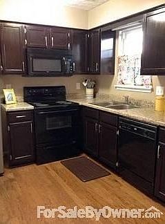 Kitchen
						:
						Recently stained cabinets, updated counter tops, hardwood flooring.