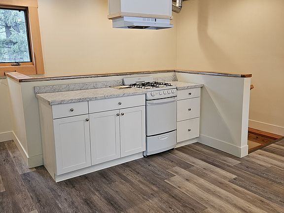 Open kitchen with a dining area along side.