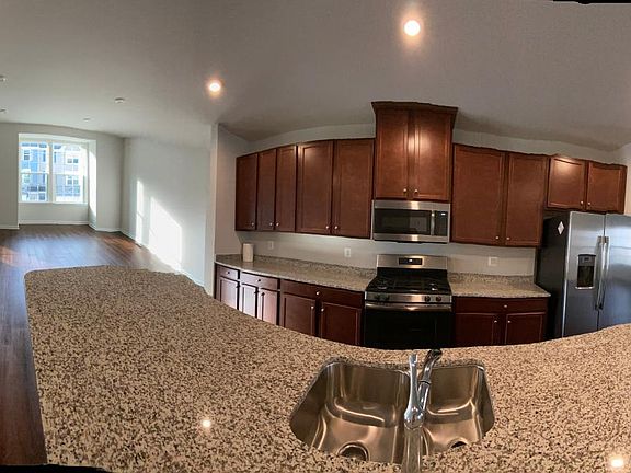 Panaromic View of Kitchen, Living Room and Dining Room