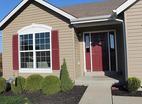 Freshly painted front door and shutters.