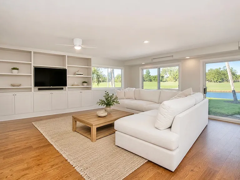 Large living room facing golf course