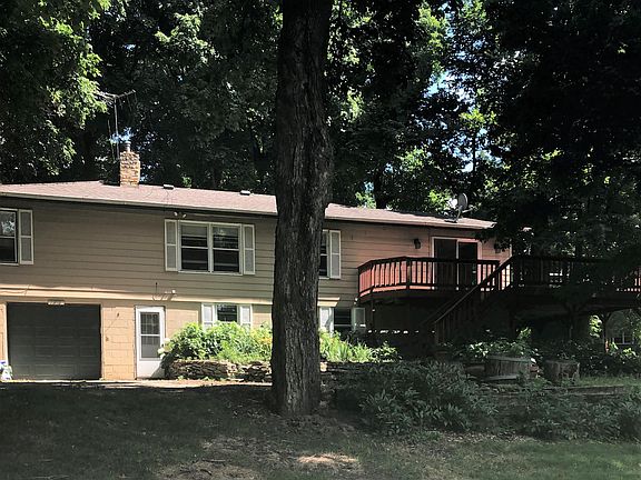 Lower level of home, deck, one car tuckunder, parking, gardens, walkout front family room.