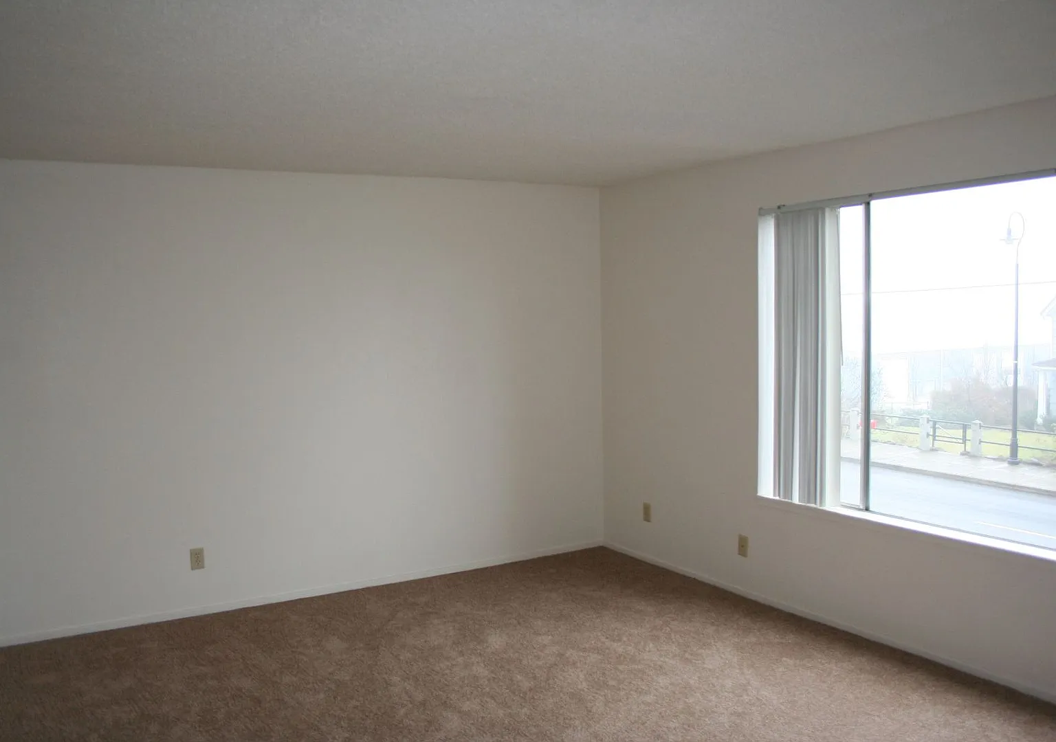 Spacious One & Two Bed Units in a Quite complex with Porches and Covered Off Street Parking — Photo 3