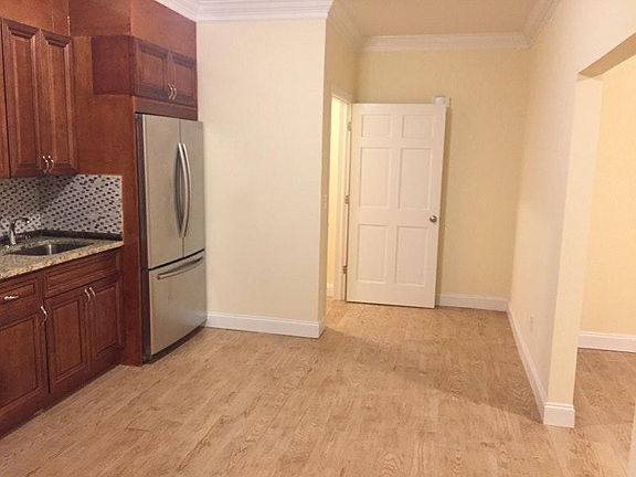 Entry into Open Concept Kitchen/Living Room Combo