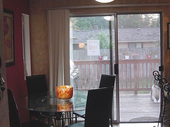 Dining area in kitchen with slider that takes you out to deck.