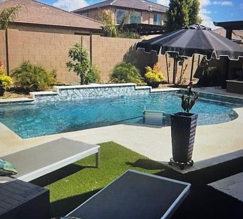 Custom backyard with pool, fire pit cabana, it feels like vacation.