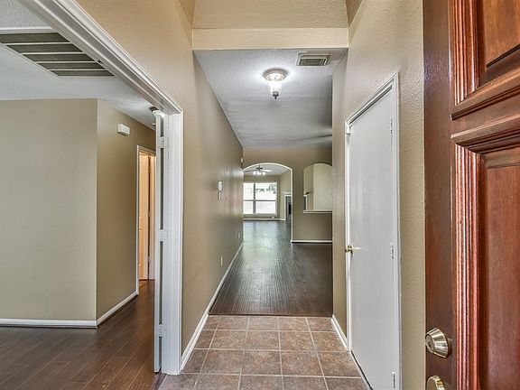 The double door way to the left leads to a unique area. It is very flexible room with a bedroom to the right and a bedroom to the left. Room sit behind french doors.