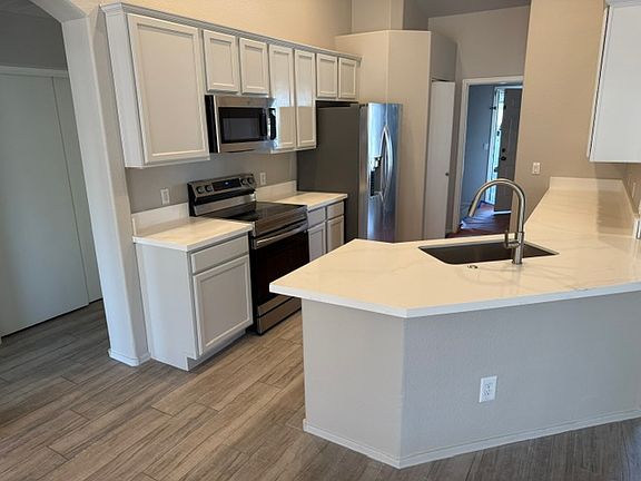 Updated quartz counters, new cabinets and tile.