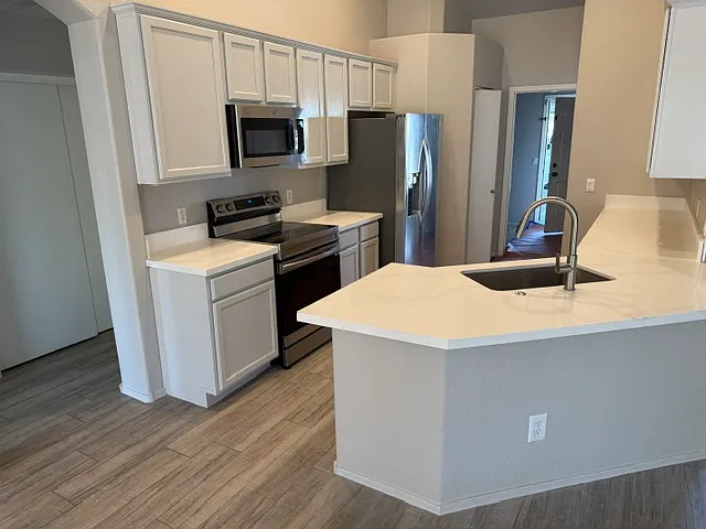Updated quartz counters, new cabinets and tile.