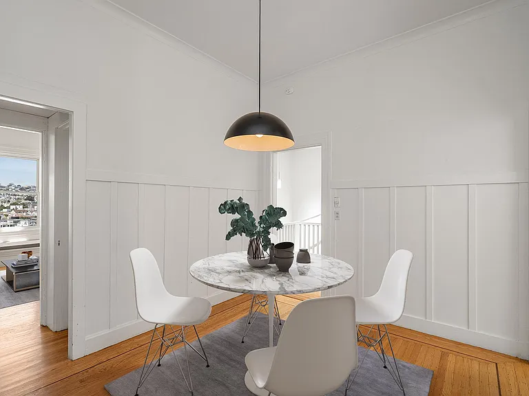 Formal dining room with wainscotting